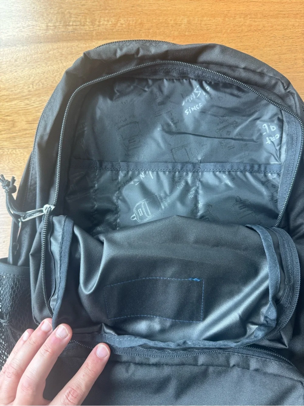 Jansport Black Backpack with Blue Logo Patch